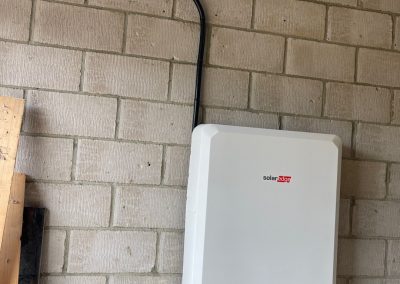 solar edge battery fitted on a block wall
