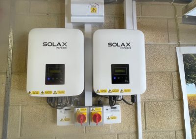 two solar inverters on a wall