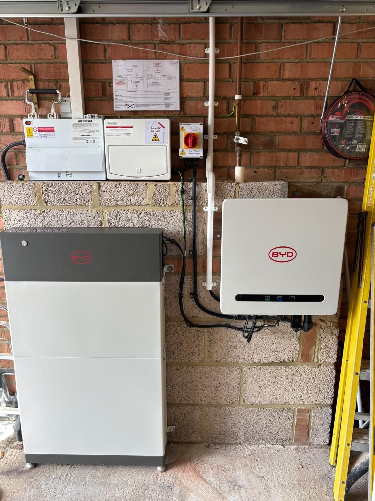 BYD Battery-Box storage tower and BYD Power-Box hybrid inverter installed in a garage at a home in Verwood, Dorset