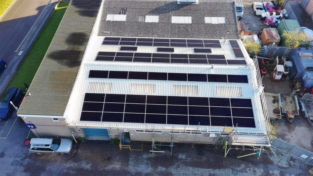 Solar panels on the factory roofs at TransDev Poole seen from directly above