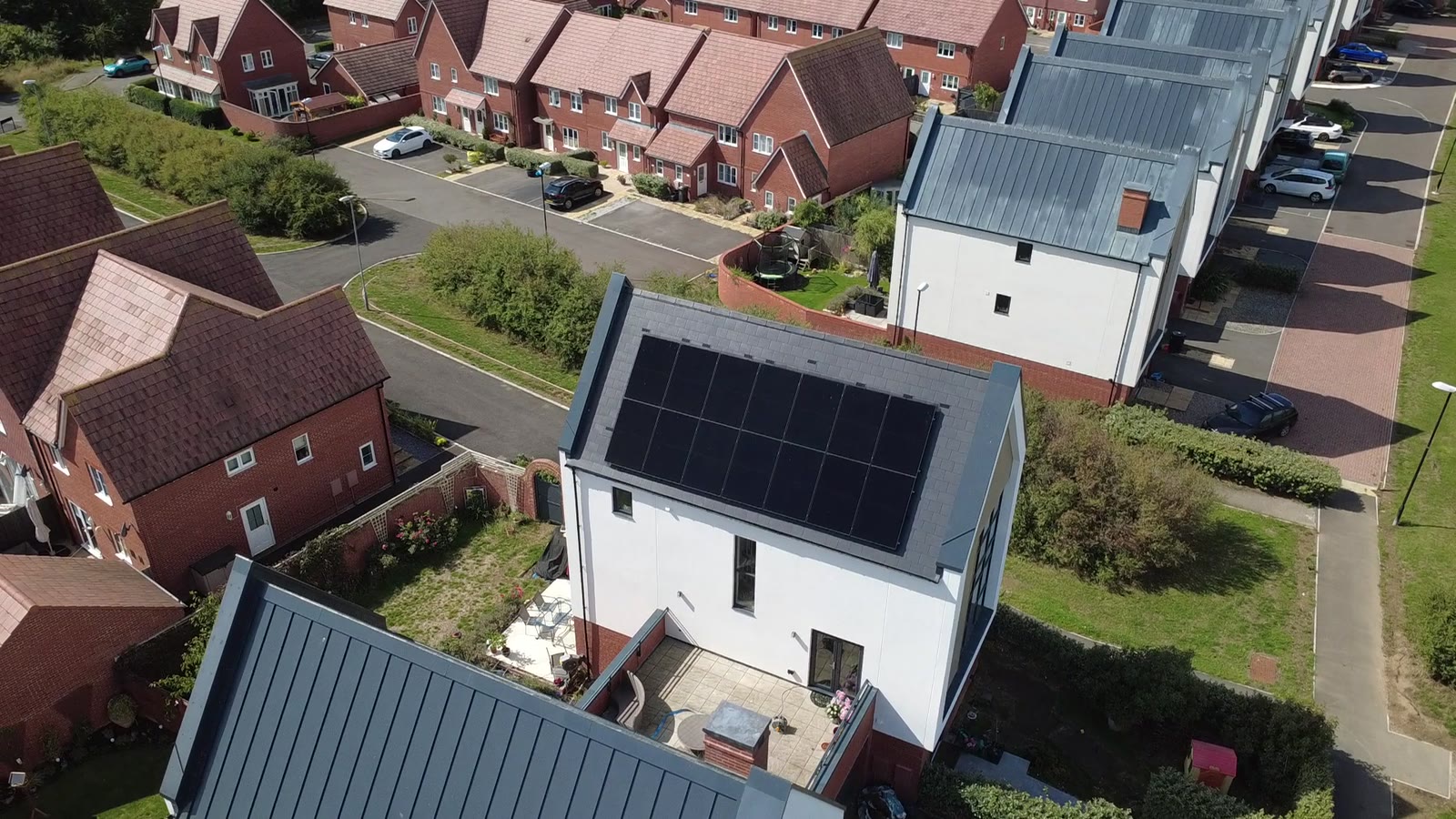 Aerial view of a Reading home with solar panels and battery storage by DES Renewable Energy